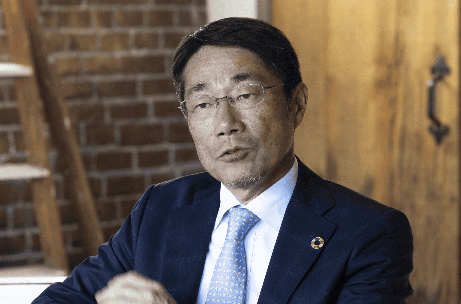 Takao Nukui, Executive Officer and President of MM Kenzai Co., Ltd., speaking.